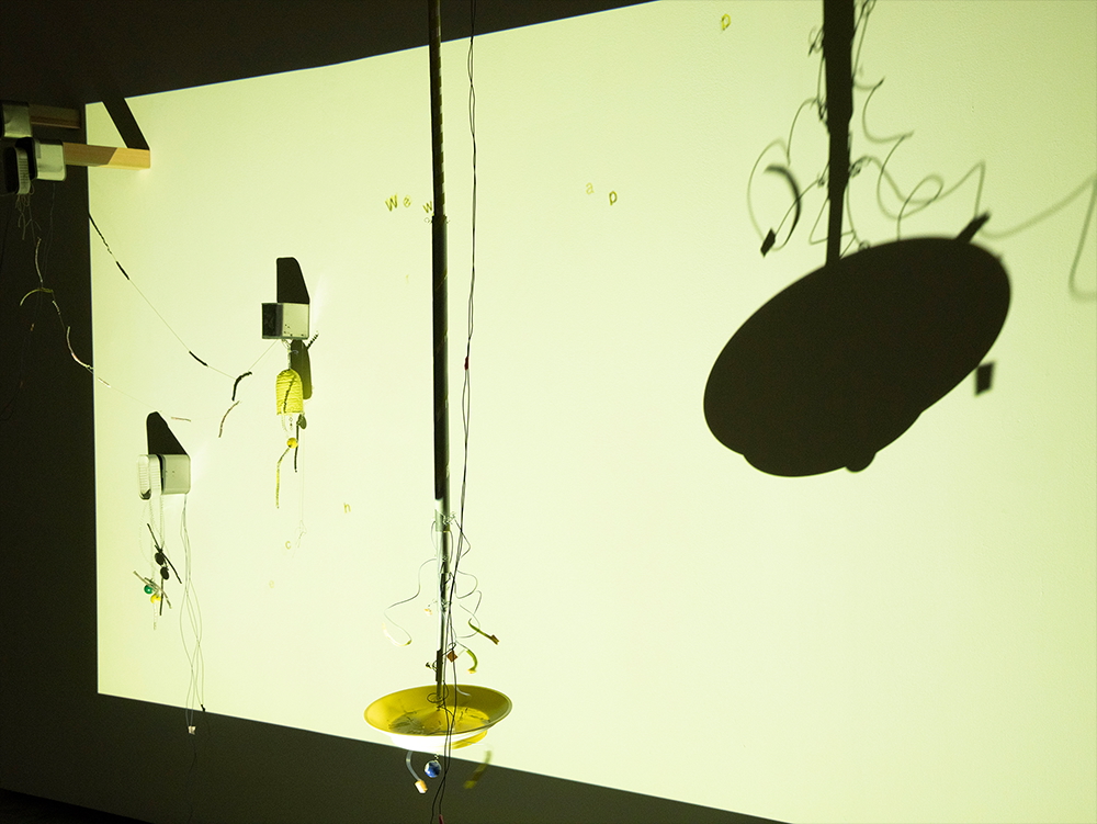 We Were Once Happy installation view with small moving assemblages