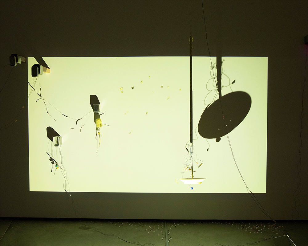 Detail of We Were Once Happy with tape, wires, and kinetic components